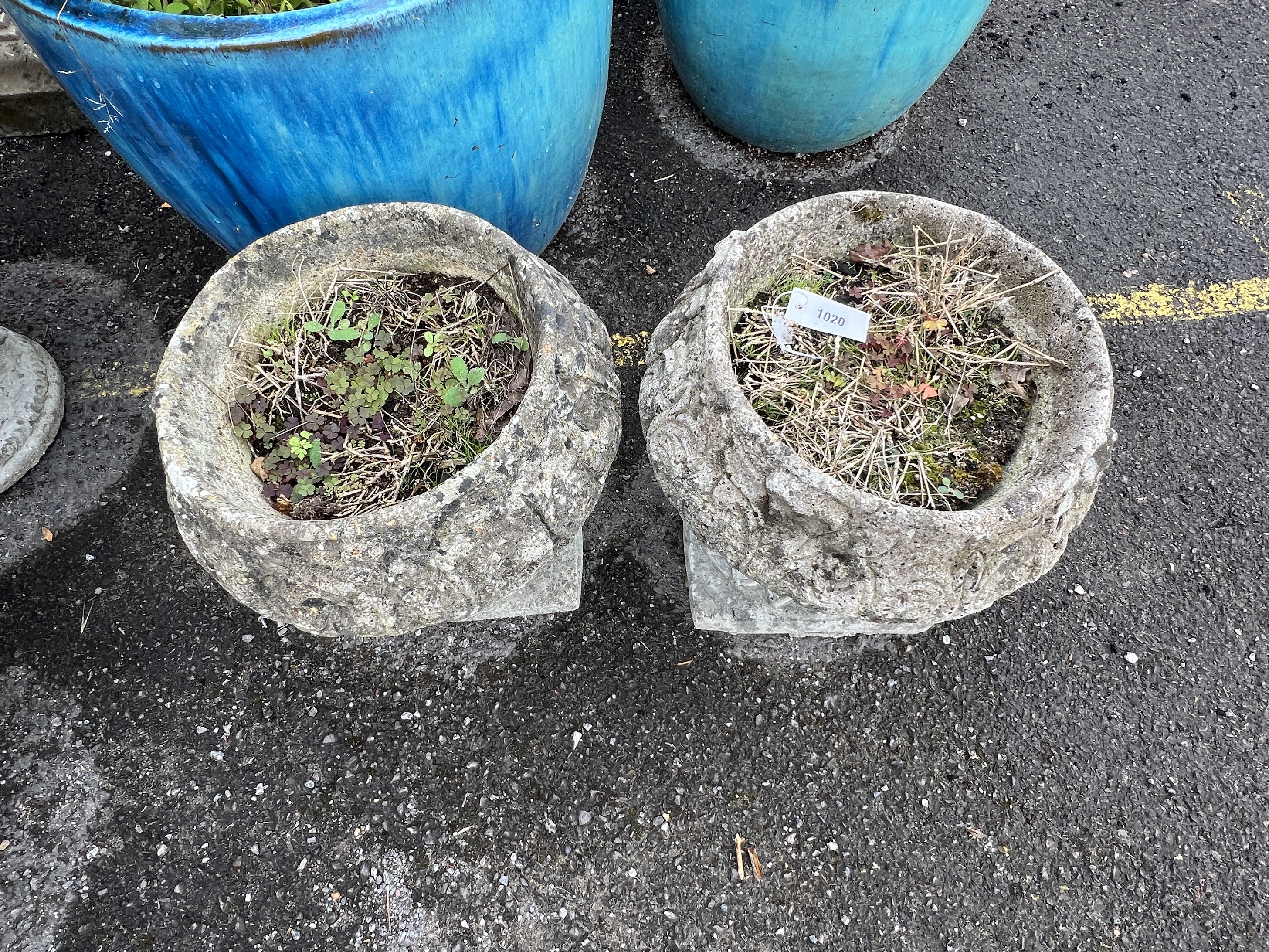 A pair of circular reconstituted stone garden planters, diameter 40cm, height 37cm